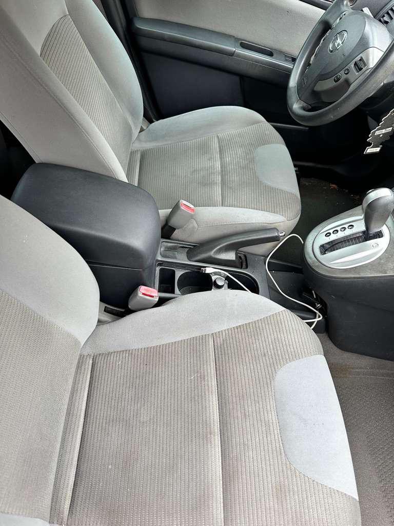 Gray front seat before cleaning